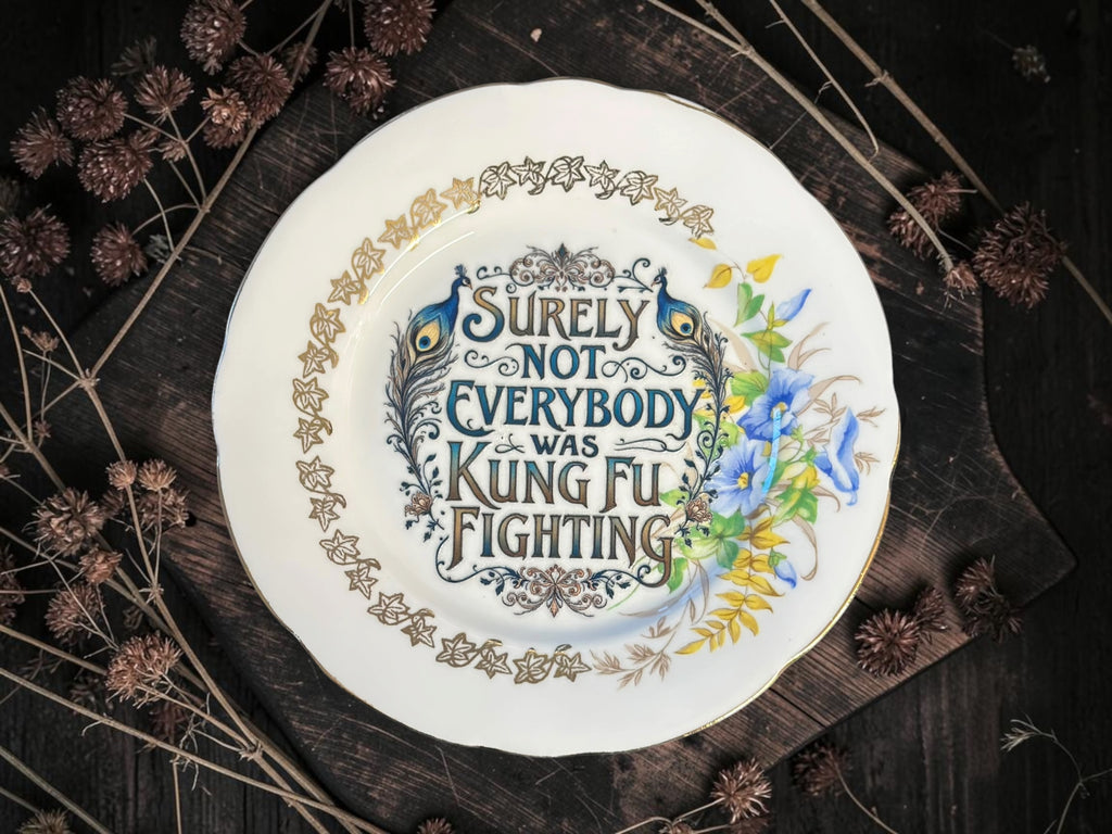 Vintage plate with the words Surely Not Everybody Was Kung Fu Fighting