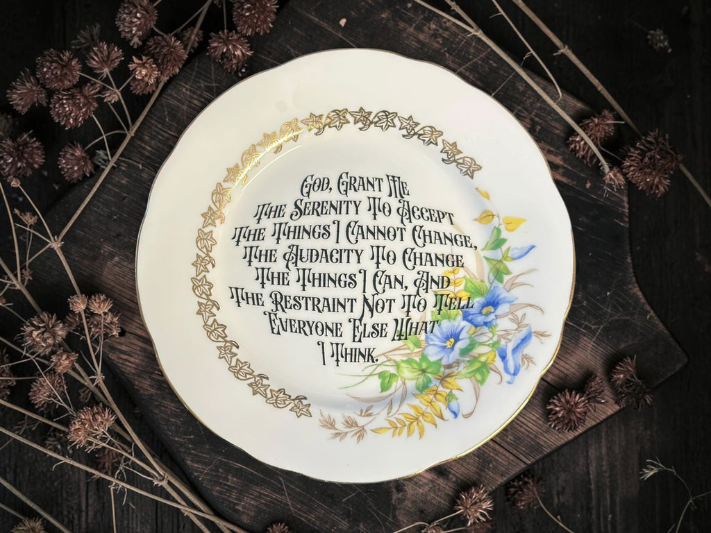 Vintage plate with the words God, Grant Me the Serenity to Accept the Things I Cannot Change, the Audacity to Change the Things I Can, and the Restraint Not to Tell Everyone Else What I Think.