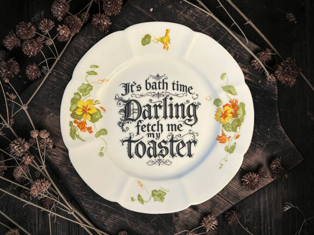 Vintage plate with the words It's Bath Time, Darling. Fetch Me the Toaster