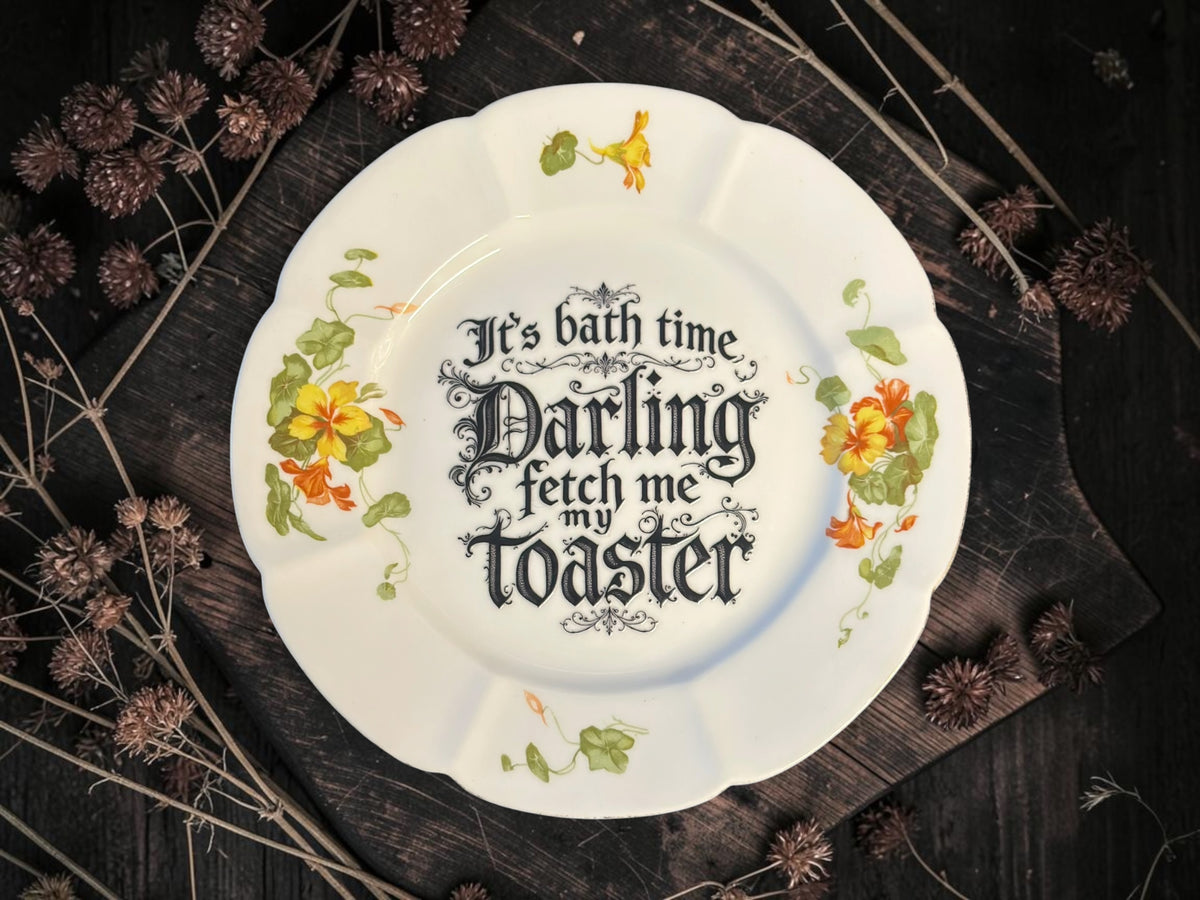 Vintage plate with the words It's Bath Time, Darling. Fetch Me the Toaster
