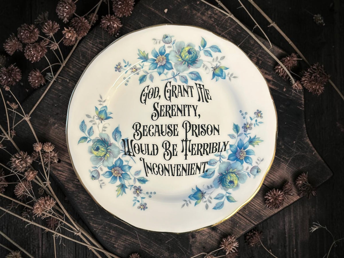 Vintage plate with the words God, Grant Me Serenity, Because Prison Would Be Terribly Inconvenient