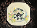 Vintage plate with the words Disappointments. All of You.