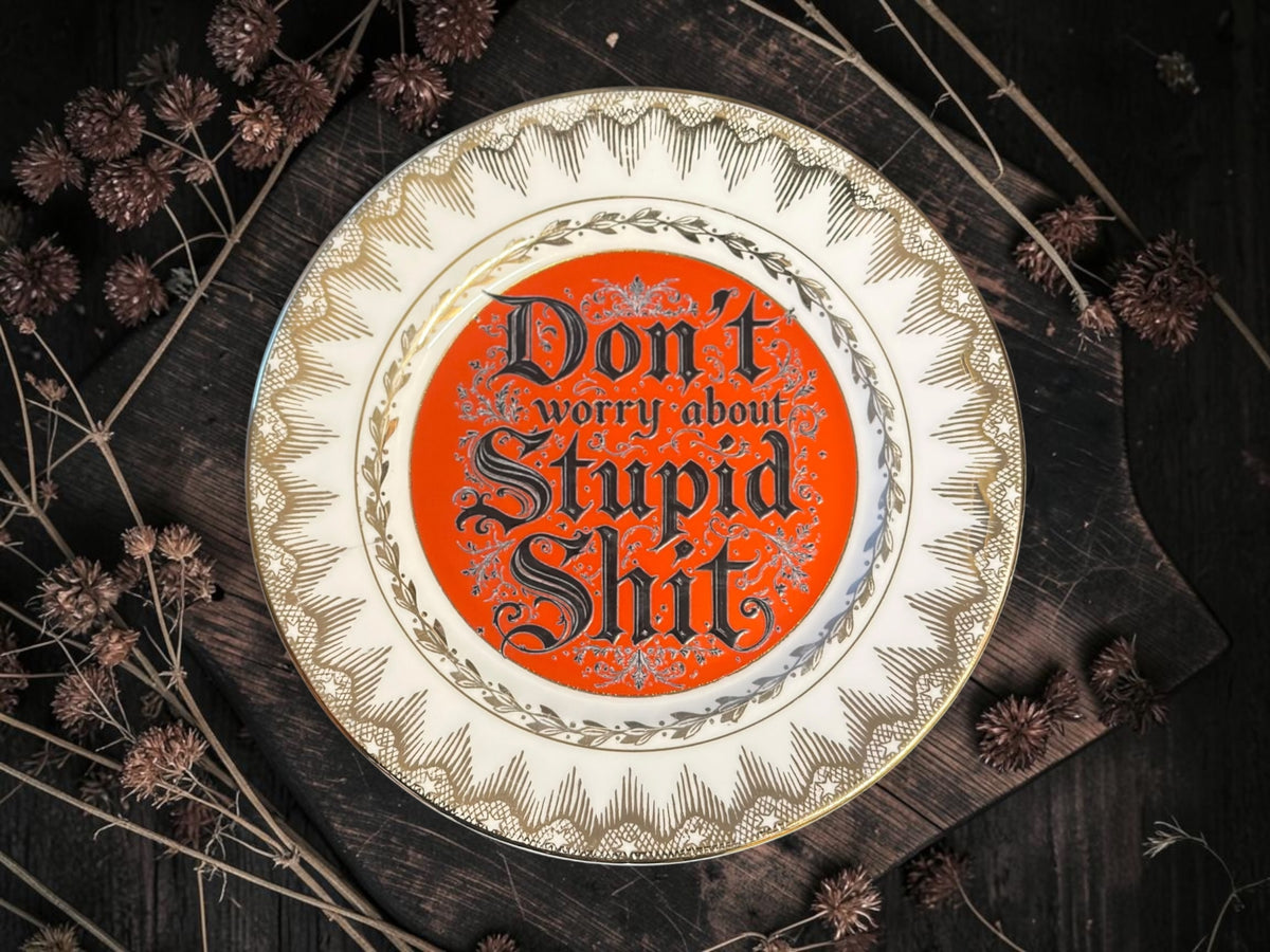 Vintage plate with the words Don't Worry About Stupid Shit