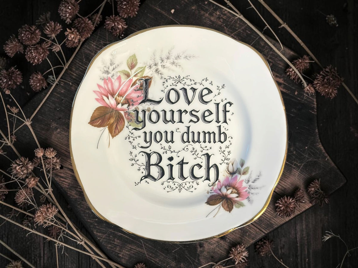 Vintage plate with the words Love Yourself, You Dumb Bitch
