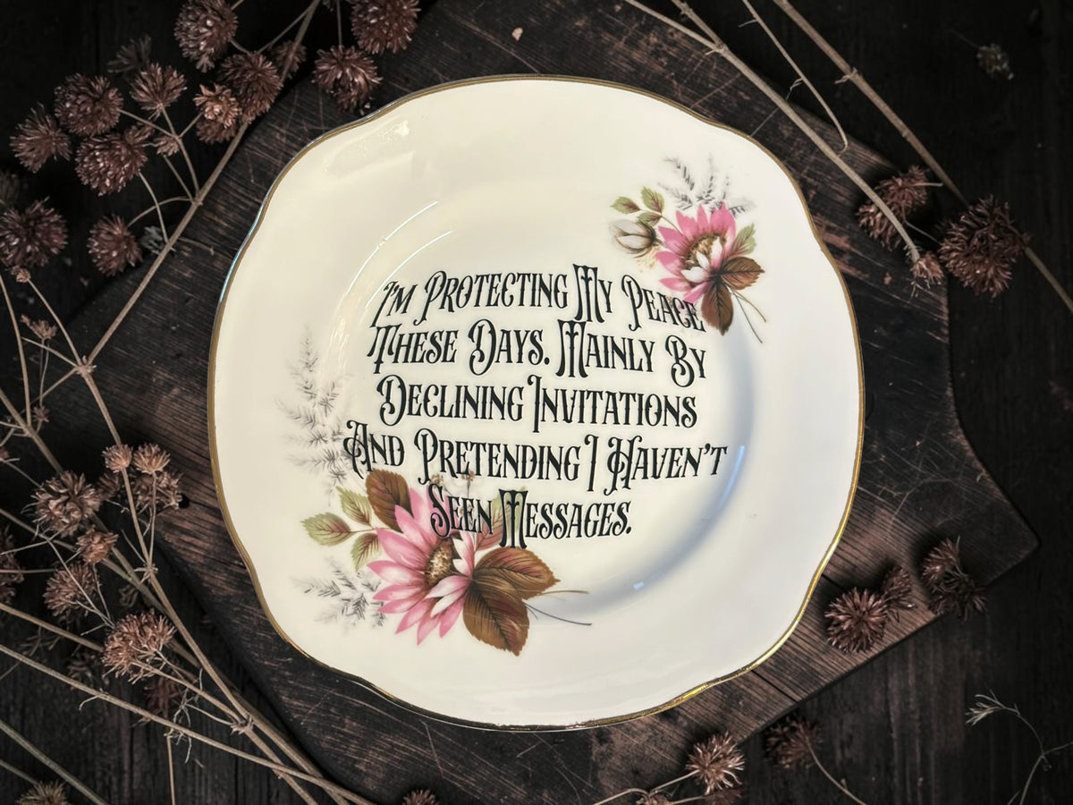 Vintage plate with the words I'm Protecting My Peace These Days, Mainly by Declining Invitations and Pretending I Haven't Seen Messages.