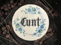 Vintage plate with the words Cunt