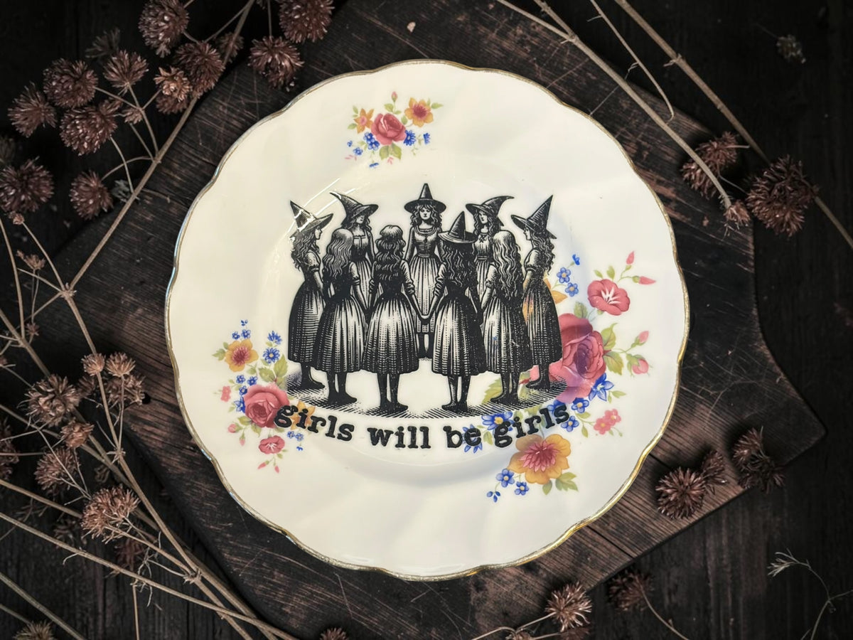 Vintage decorative plate reading Girls Will Be Girls