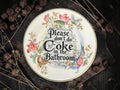 Vintage decorative plate reading Please Don’t Do Coke in the Bathroom