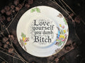 Vintage decorative plate reading Love Yourself You Dumb Bitch