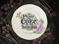 Vintage decorative plate reading Please Do Coke in the Bathroom