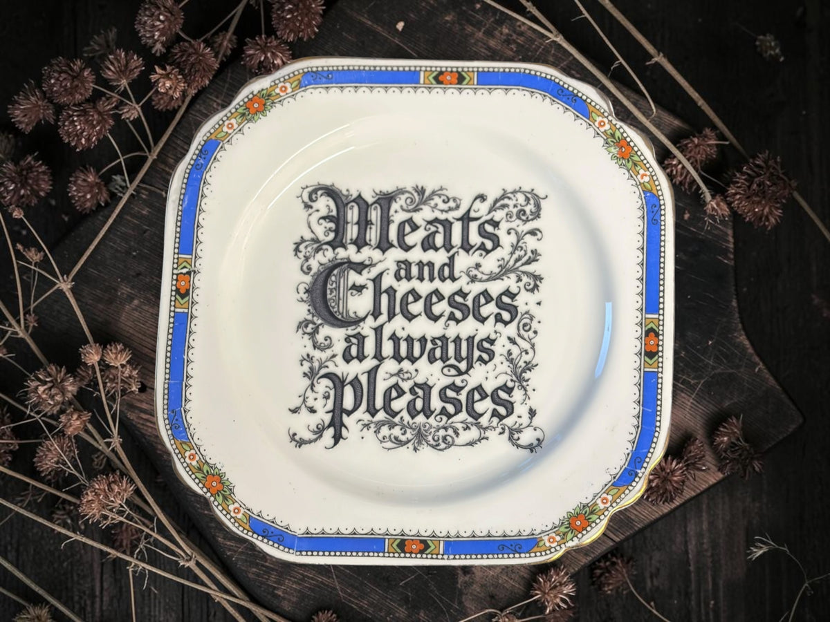Vintage decorative plate reading Meats and Cheeses Always Please