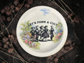 Vintage decorative plate featuring Let's Form a Cult