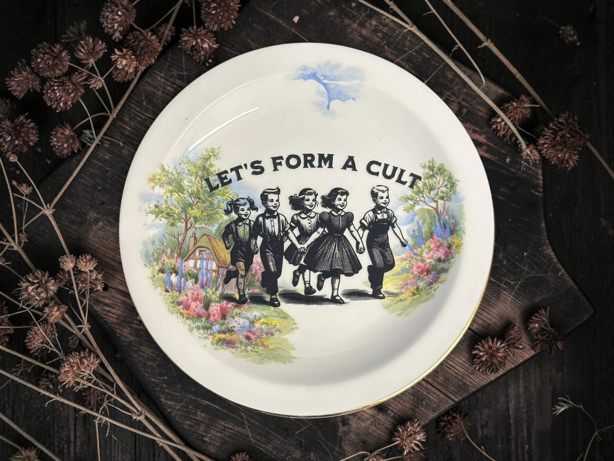 Vintage decorative plate featuring Let's Form a Cult