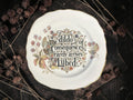 Vintage decorative plate featuring The Dildo of Consequences Rarely Arrives Lubed
