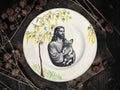 Vintage decorative plate featuring Jesus Holding a Cat