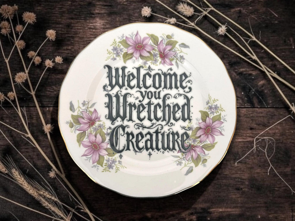 Welcome wretched creature, vintage plate with stand