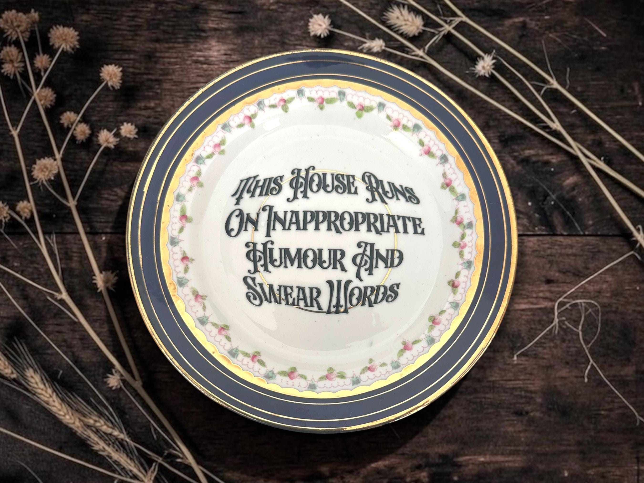 This house runs on inappropriate humor and swear words, vintage plate with stand