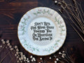 Vintage floral plate reading Don't Bite The Hand That Fingers You Or Whatever The Saying Is