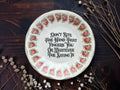 Vintage rose plate reading Don't bite the hand that fingers you or whatever the saying is